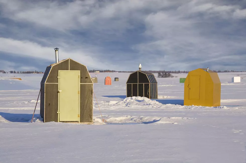 Ice fishing shacks out on the frozen harbour.